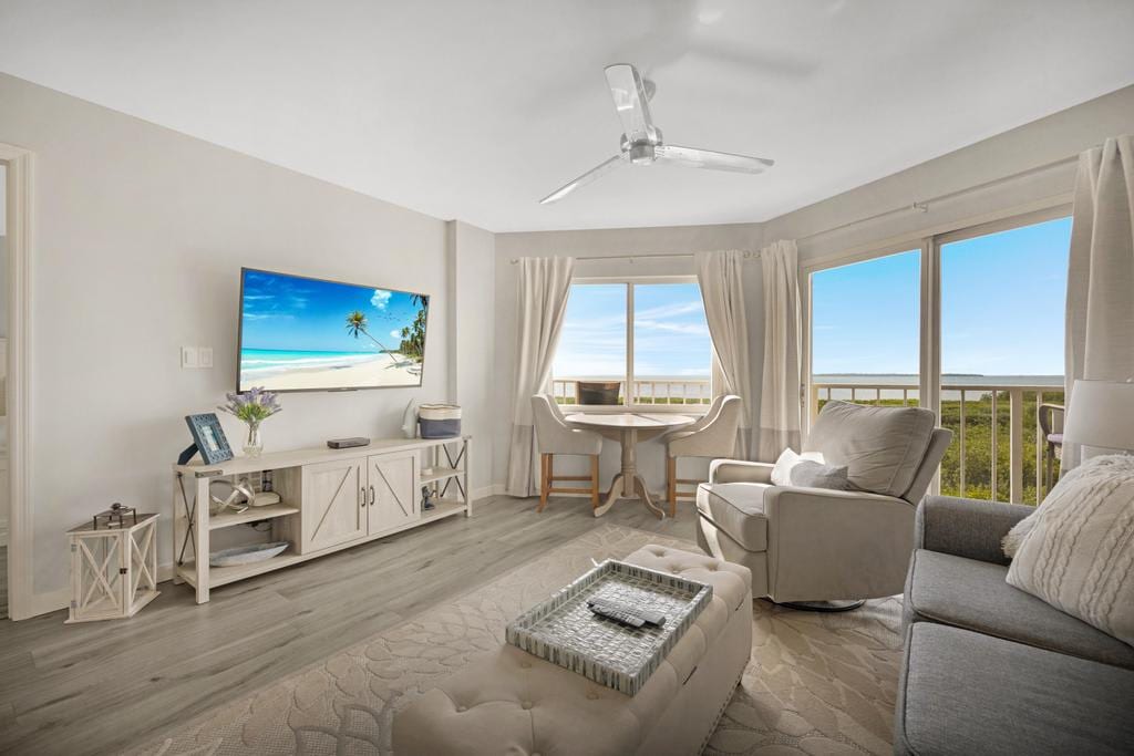 Heavenly Hideaway living area opening toward an ocean-view balcony